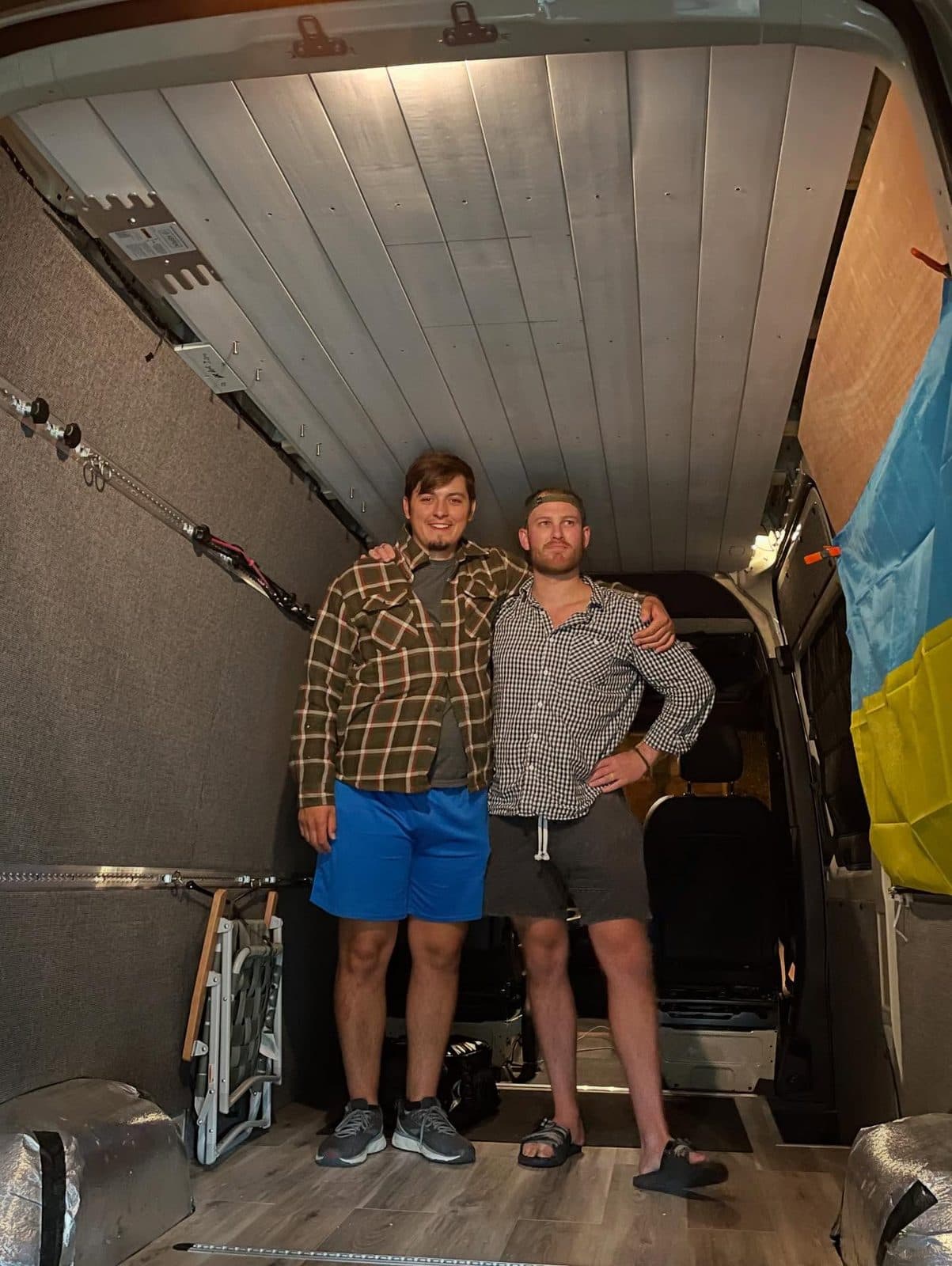 Bare Sprinter cargo shell mid-build, insulation exposed