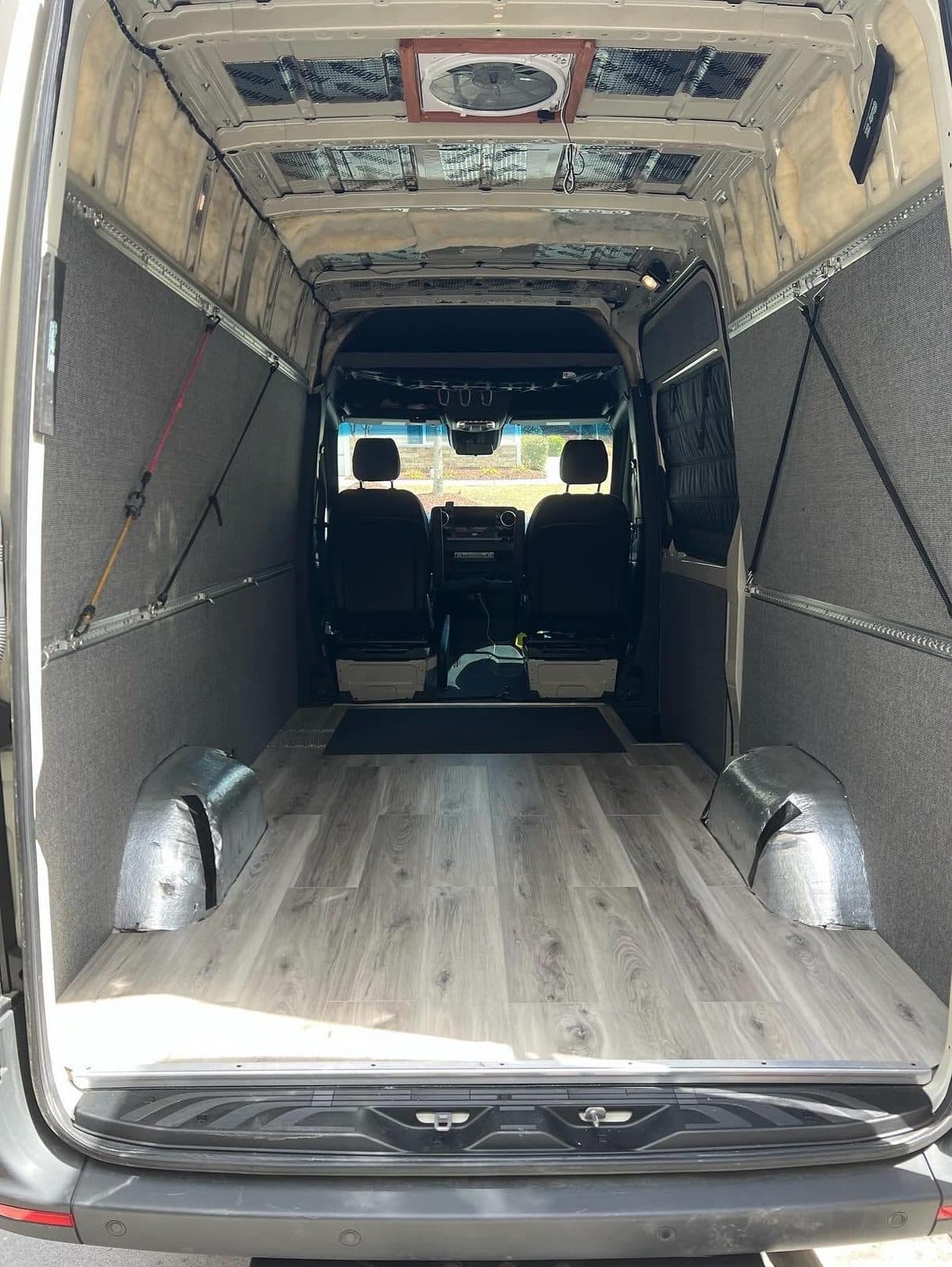 Wall framing and insulation installed inside the van
